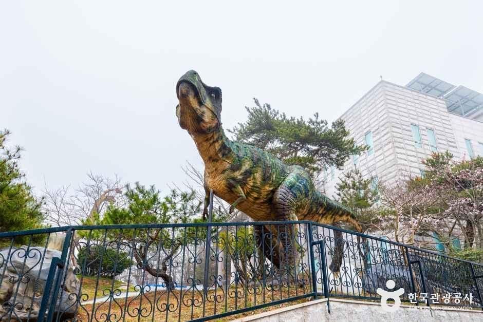 Dinosaur figures by the waterfall garden