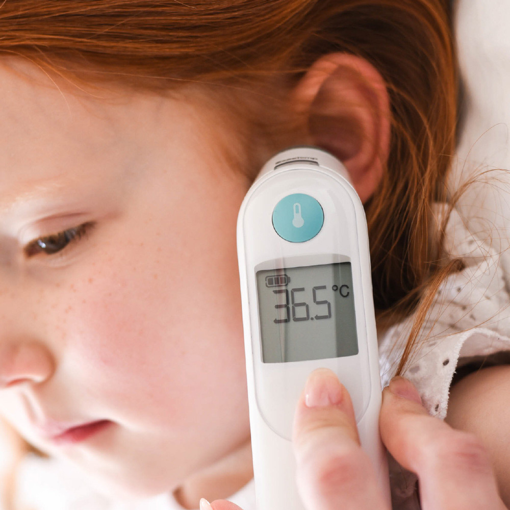 Braun ThermoScan ear thermometer showing 36.8°C reading on LCD display