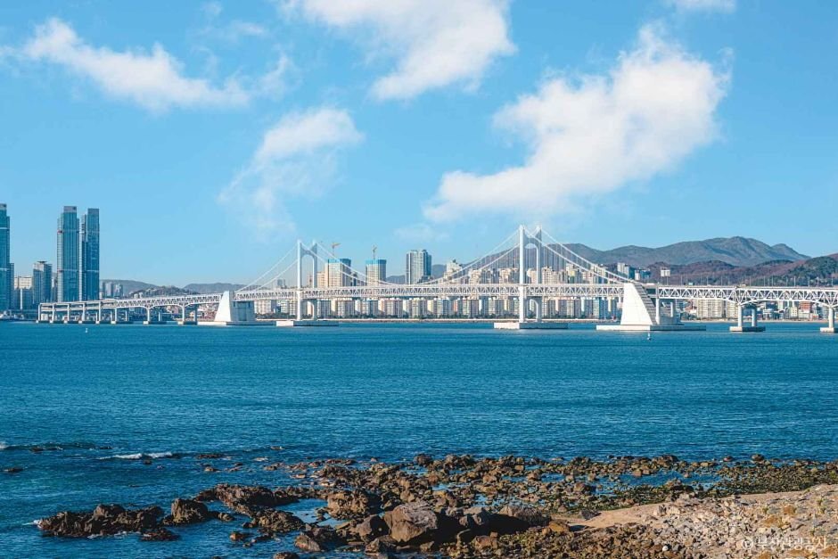 Gwangalli Beach and Gwangan Bridge on a sunny day