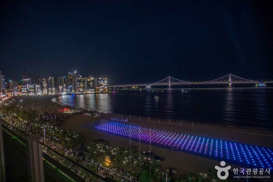 Gwangalli Beach at night with lit Gwangan Bridge