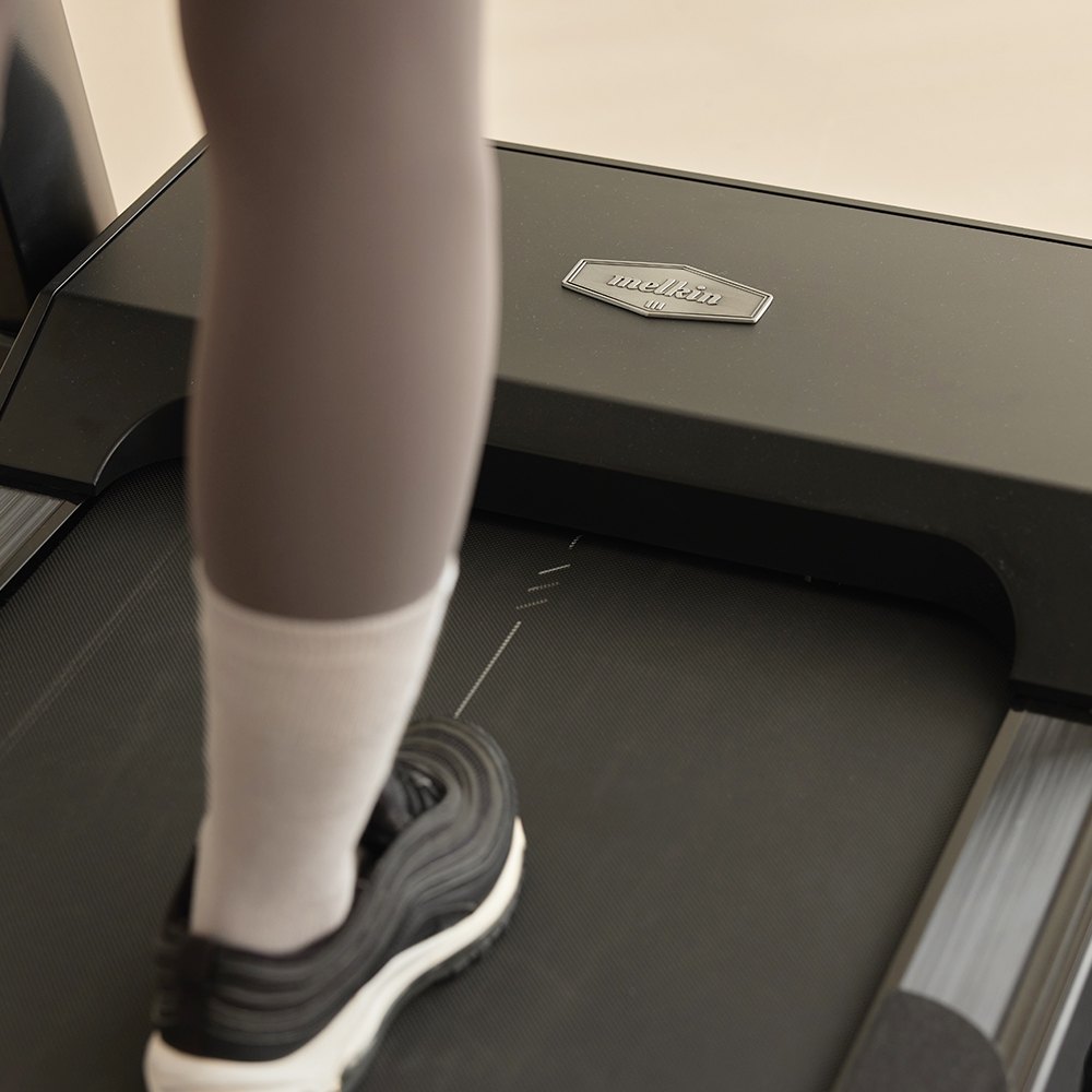 Close-up of running shoe on Melkin RX8 treadmill belt