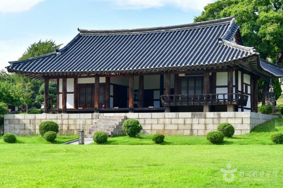 Historic stone stele monuments and giant trees inside the Ulsan Dongheon courtyard