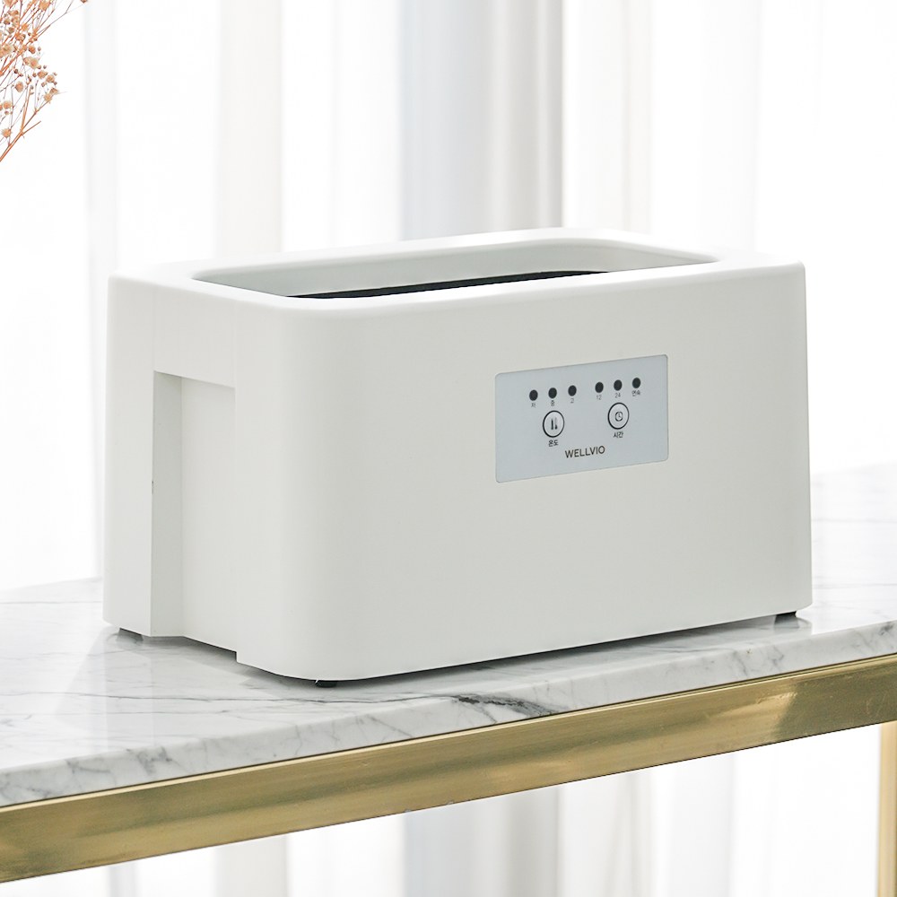 Wellbio Classic paraffin bath on a marble table
