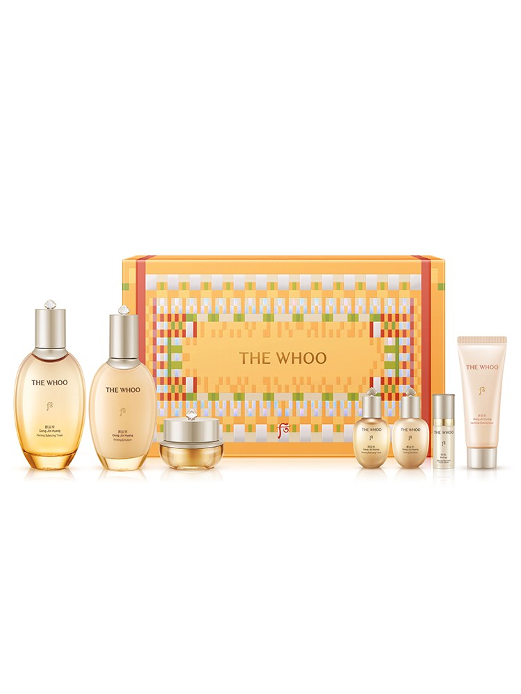 The Whoo Gongjinhyang toner, emulsion, cream jar and minis lined up in front of the orange gift box